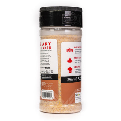 Clear plastic shaker of Real Salt brand organic seasoning showcasing nutritional information and brand details.